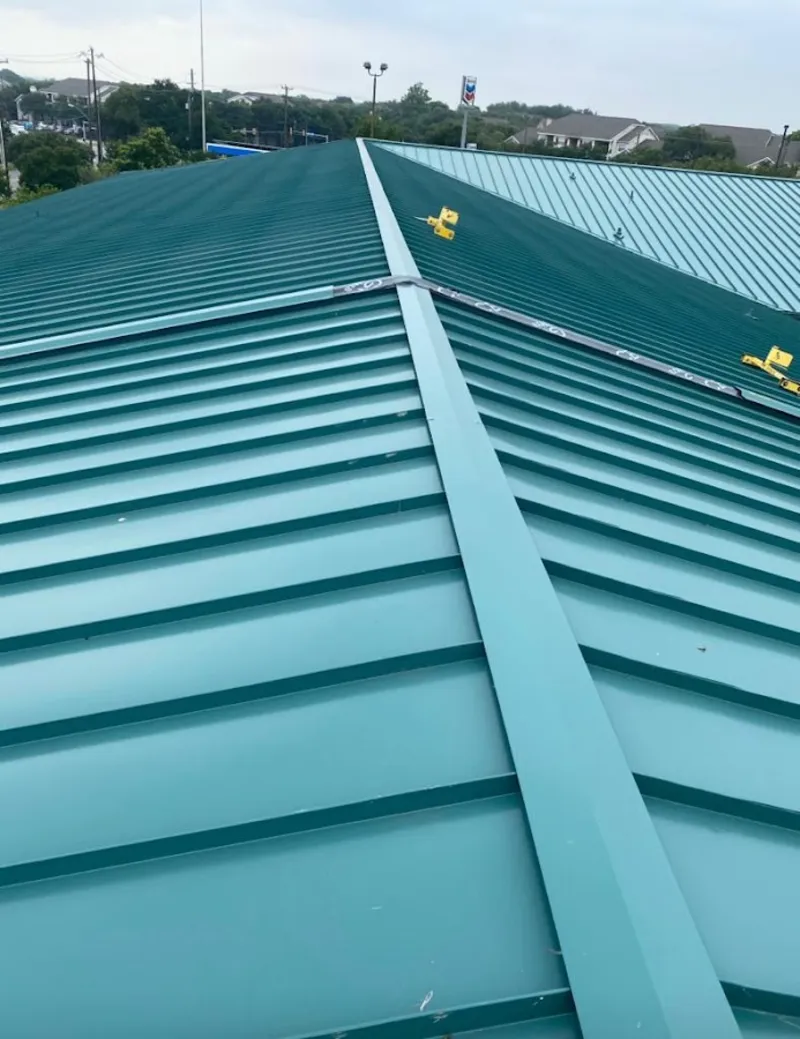Green commercial metal roof ridge and valley for Metal Roof Repair in California Polytechnic State University