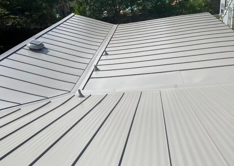 Solar attic fan installed on a metal roof for Roof Ventilation in California Polytechnic State University